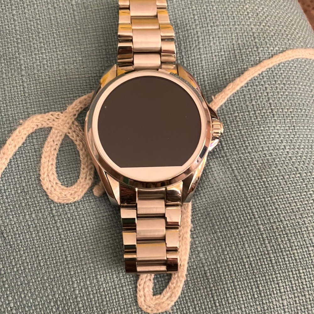 Brand new Michael Kors smart watch.Extra leather band. And charger